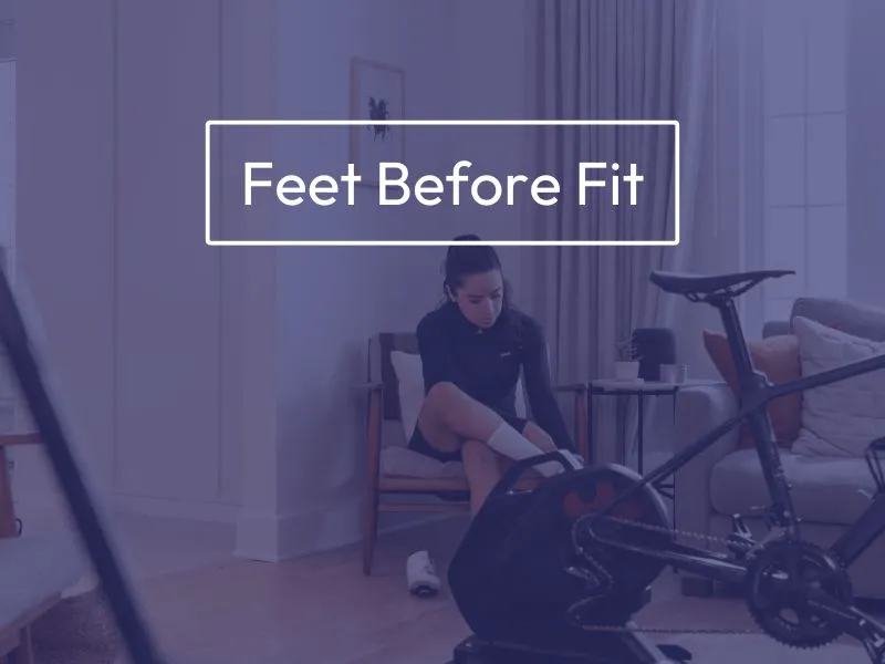 Woman sitting beside indoor bike trainer with pain throughout her feet, title on screen reads "Feet Before Fit".