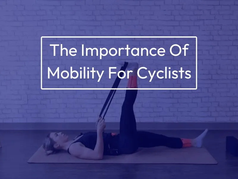 Female cyclist completing a hamstring stretch by laying on their back, placing a resistance band around the arch of their right foot, and pulling the band such as to extend the leg upwards.