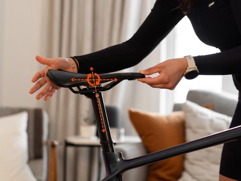 Saddle Height 101: A Comprehensive Guide To Setting Your Saddle Height - MyVeloFit Woman adjusting saddle height, position, and fore-aft position